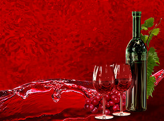 Image showing Bottle, wineglass, grapes and dynamics splash wine