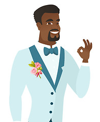 Image showing Young african-american groom showing ok sign.