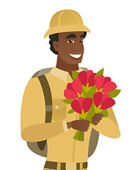 Image showing Young african traveler holding bouquet of flowers.