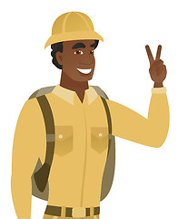 Image showing African-american traveler showing victory gesture.