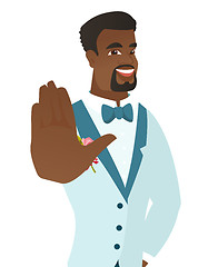 Image showing African-american groom showing palm hand.