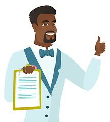 Image showing Groom holding clipboard and giving thumb up.