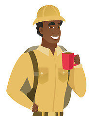 Image showing African-american traveler holding cup of coffee.