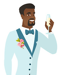 Image showing African-american groom holding glass of champagne.