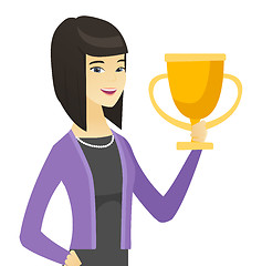 Image showing Asian business woman holding a trophy.