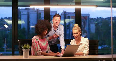 Image showing Multiethnic startup business team in night office