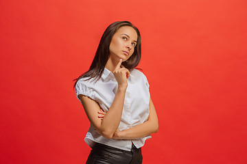 Image showing Young serious thoughtful business woman. Doubt concept.