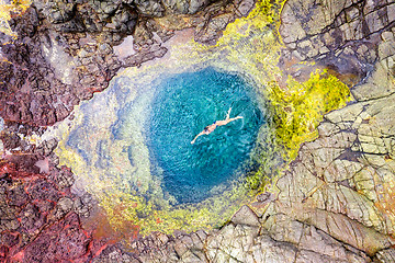 Image showing Swimming in blue water ocean tidal swimming holes