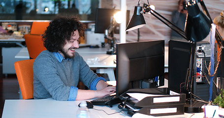 Image showing businessman working using a computer in startup office