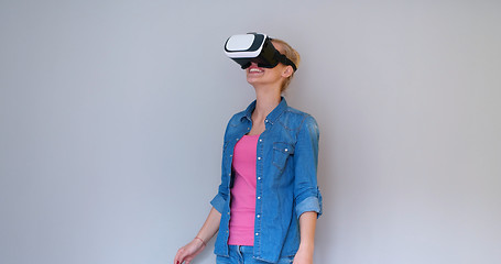 Image showing girl using VR headset glasses of virtual reality