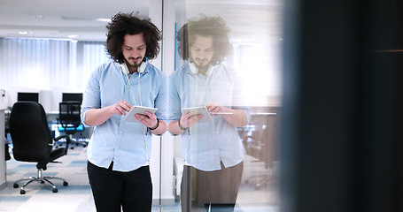 Image showing businessman using tablet computer