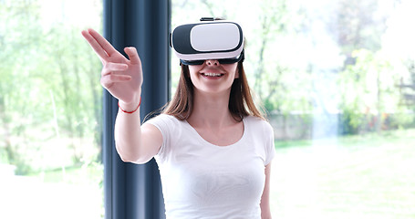 Image showing woman using VR-headset glasses of virtual reality