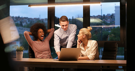 Image showing Multiethnic startup business team in night office