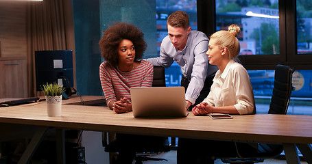 Image showing Multiethnic startup business team in night office