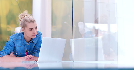 Image showing young women using laptop computer on the floor