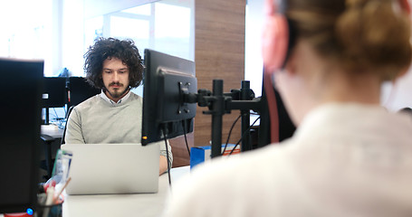 Image showing businessman working using a laptop in startup office