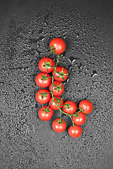 Image showing Top view of fresh organic cherry tomatoes bunch.