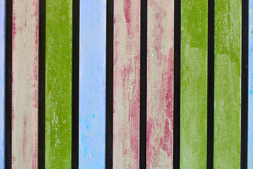 Image showing Colorful blue, pink and green wooden aged plank wall.