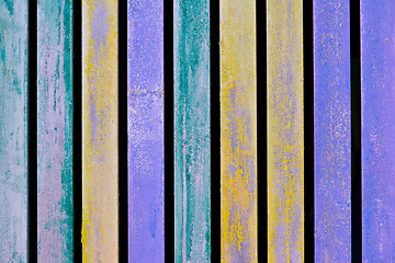 Image showing Colorful blue, yellow and turquoise wooden aged plank wall.