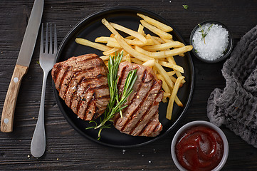 Image showing grilled steak and fried potatoes