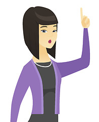 Image showing Business woman with open mouth pointing finger up.