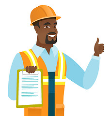 Image showing African builder with clipboard giving thumb up.