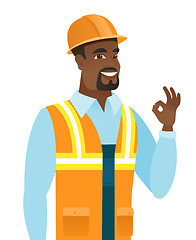Image showing African-american smiling builder showing ok sign.
