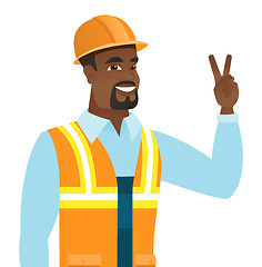 Image showing African-american builder showing victory gesture.