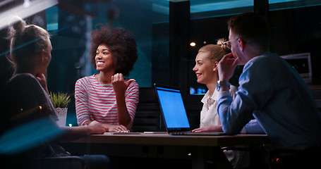 Image showing Multiethnic startup business team in night office