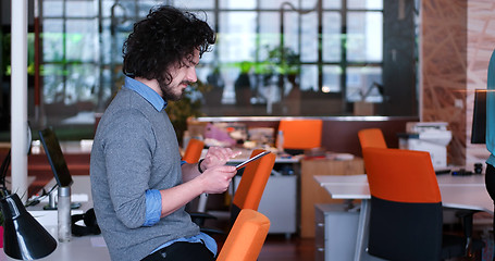 Image showing businessman using tablet computer