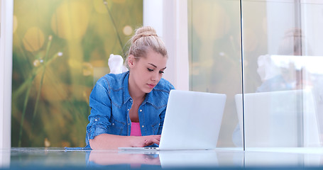 Image showing young women using laptop computer on the floor