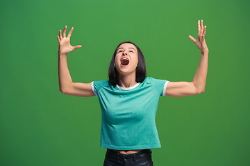 Image showing Winning success woman happy ecstatic celebrating being a winner. Dynamic energetic image of female model