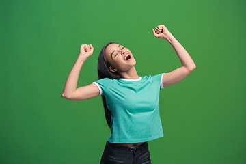 Image showing Winning success woman happy ecstatic celebrating being a winner. Dynamic energetic image of female model