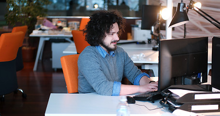 Image showing businessman working using a computer in startup office