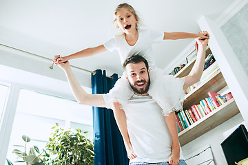 Image showing Father and his six years kid girl at home