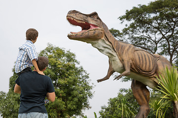 Image showing Father and son playing in the adventure dino park.