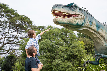 Image showing Father and son playing in the adventure dino park.