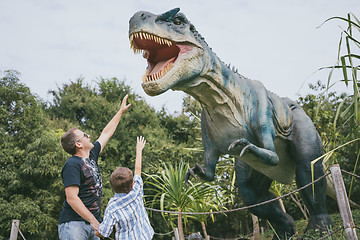 Image showing Father and son playing in the adventure dino park.