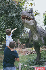 Image showing Father and son playing in the adventure dino park.