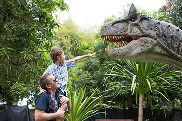 Image showing Father and son playing in the adventure dino park.