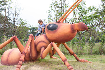 Image showing Happy little boy playing in the park