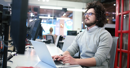 Image showing businessman working using a laptop in startup office