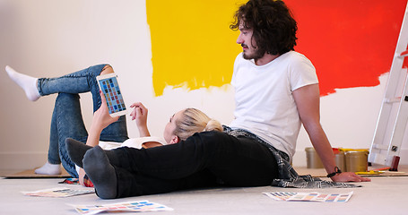 Image showing Happy young couple relaxing after painting