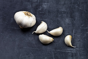 Image showing Fresh raw organic garlic on black board