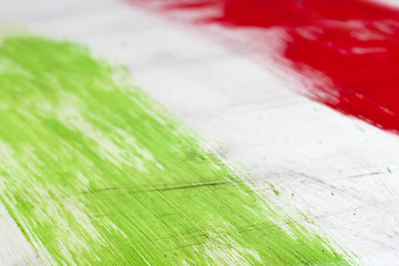 Image showing  Italian flag painted with  brush strokes on white background.