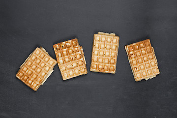 Image showing Belgium waffers on black board background.