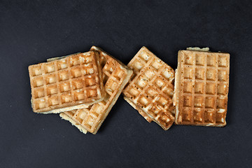 Image showing Belgium waffers on black board background.