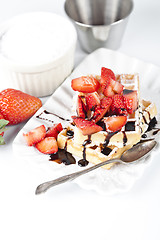 Image showing Belgium waffers with sugar powder, strawberries and chocolate on