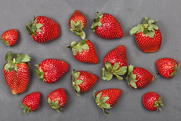 Image showing Fresh ripe strawberries on black background.