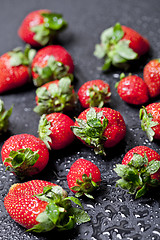 Image showing Fresh ripe strawberry with water drops closeup.